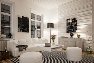 Hingucker Wohnzimmerlampe: Ein schwarz-weiß eingerichtetes Wohnzimmer mit einer weißen Couch, weißen, runden Sitzpolstern und einer Stehlampe mit schwarzem Schirm.