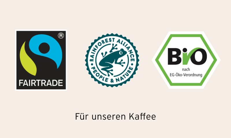 Logos von Fairtrade, Rainforest Alliance und Bio